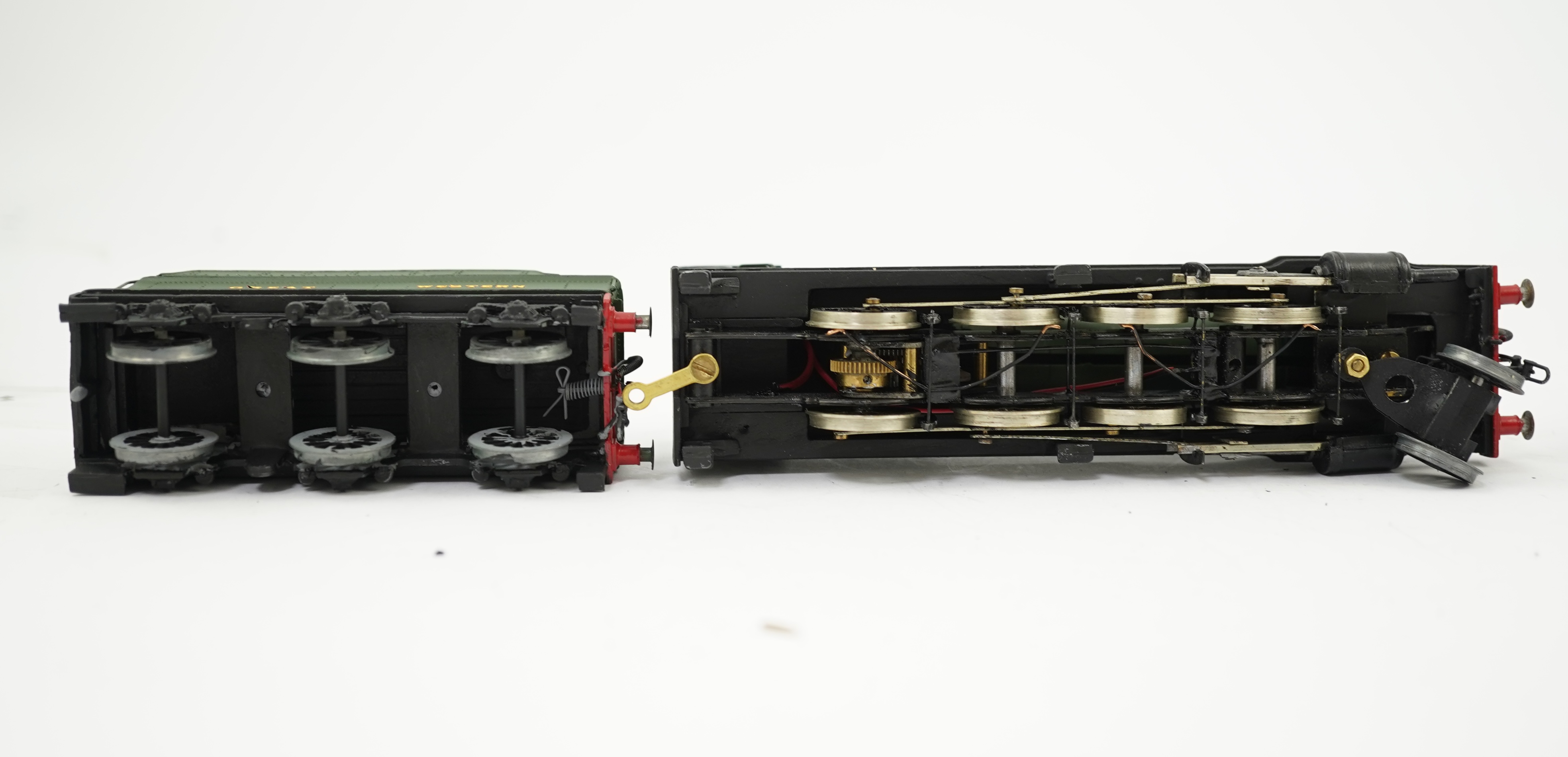 Three 00 gauge brass and white metal kit built GWR tender locomotives; a 2884 class 2-8-0, 2884, together with an 33xx class 4-4-0, 3454, and a War Dept. 2-8-0, 3012, all constructed, painted and lined to a high standard